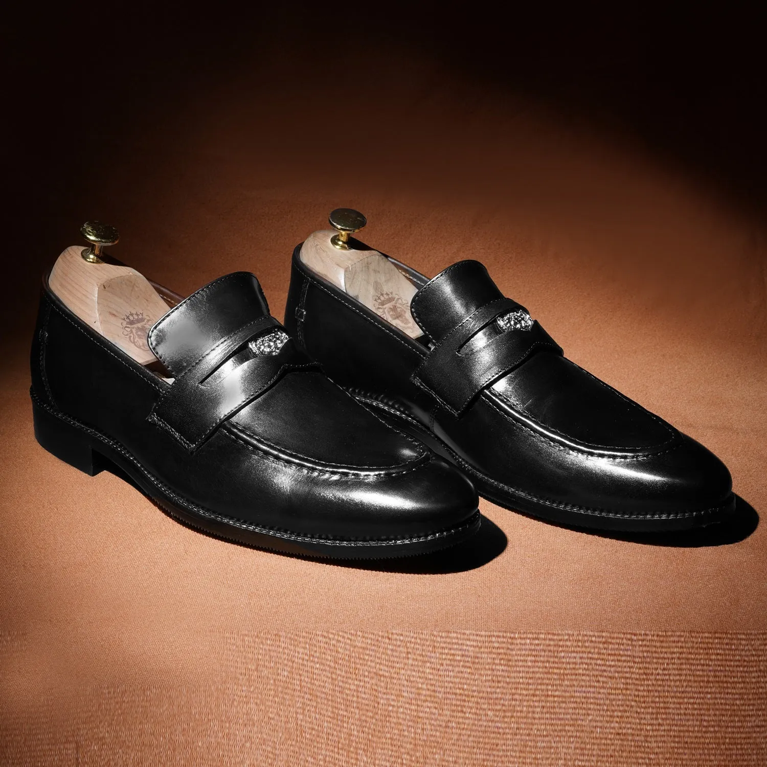 Brand Lion Logo Penny Loafers in Black Leather